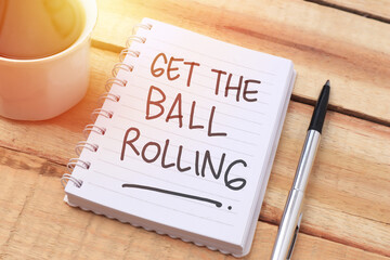 get the ball rolling, text words typography written with paper, life and business motivational inspi