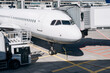 © Alina Hvostikova/Stocksy - Modern plane with jet bridge on airfield