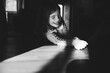 © Maria Manco/Stocksy - portrait of little girl in sunny spot indoors