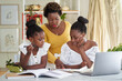 © Juno/Stocksy - family school homework at home