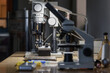 © Milles Studio/Stocksy - Illuminated microscope on desk in apiary