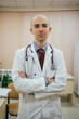 © Vradiy Art/Stocksy - Male doctor in office at hospital