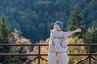 © Milles Studio/Stocksy - Sportswoman stretching arm near forest