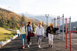 © Milles Studio/Stocksy - Female athletes walking on sports ground near mountains