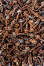 Background Texture Of Large Rusty Bolts Stacked