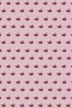 Pattern Of Pink Round Pills On Pink
