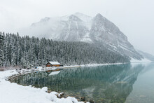 Snow-covered River Bank By Lake Louise In Banff, Alberta