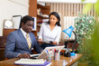 © JackF - Successful businessman talking to female colleague in office
