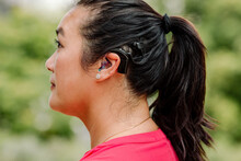 Profile Of Asian Woman With Cochlear Implant