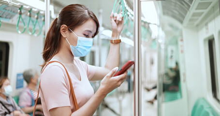 Wall Mural - woman with mask in mrt