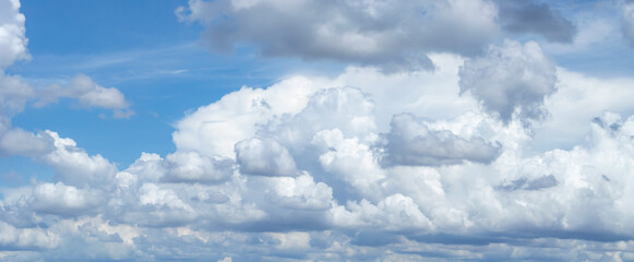 Wall Mural - blue sky background with tiny clouds. panorama white fluffy clouds in the blue sky.beautiful vast bl