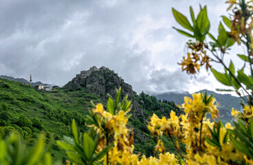 Canvas Print - Ancient ruined castle and spring mountain valley