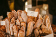 © Chris Zielecki/Stocksy - Baskets with fresh baguettes in bakery