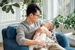© MaaHoo Studio/Stocksy - father and baby at home