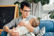 © MaaHoo Studio/Stocksy - father and baby at home