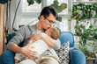 © MaaHoo Studio/Stocksy - father and baby at home