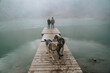 © Guaita Studio/Stocksy - Couple on wooden dock in frozen lake in mountain