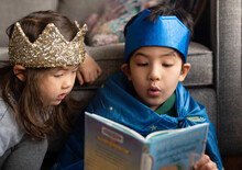 Kids Reading Exciting Book Together