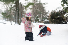 Happy Kids Playing In Snow