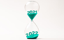 Hourglass With Blue Sand For Change 2021 To 2022 Year , Countdown And Preparation Merry Christmas And Happy New Year Concept.