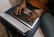 © VICTOR TORRES/Stocksy - Anonymous black man's hands typing on modern laptop