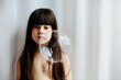 © Eloisa Ramos/Stocksy - Child girl looking the soap bubble floating
