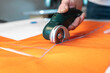 © Manu Prats/Stocksy - Artisan using electric razor to cut fabric