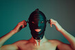 © Branko Starcevic/Stocksy - Male slave wearing a fetish mask.