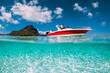 Tropical sea with sandy bottom and speed boat