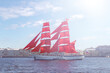 Brig with scarlet sails in the water area of the Neva. Saint Petersburg, Russia - June 2, 2021.