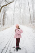 © Maria Manco/Stocksy - girl poses in winter woods
