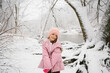 © Maria Manco/Stocksy - girl poses in snowy woods
