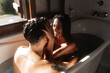 © Thais Varela/Stocksy - Couple in the bathtub.