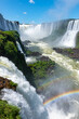 © Bisual Studio/Stocksy - Colorful rainbow over waterfall stream