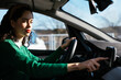 © BONNINSTUDIO/Stocksy - Young woman using GPS navigator in car