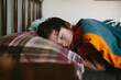© Maria Manco/Stocksy - side view of boy sleeping in bed