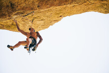 Adventurer Man Wearing Safety Harness Climbing Mountain