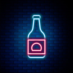 Poster - Glowing neon line Beer bottle icon isolated on brick wall background. Colorful outline concept. Vector