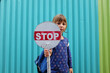 © Yury Goryanoy/Stocksy - Portrait of a child boy holding a STOP sign