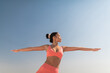 © Atolas/Stocksy - Young Asian woman practicing yoga outdoor.