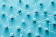 © Martí Sans/Stocksy - Rope randomly connecting round pegs