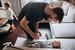 © Irina Polonina/Stocksy - Young father with his newborn son.