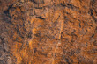 © ZHPH Production/Stocksy - Orange rock texture