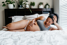 A Portrait Of An African American Woman Expecting / Pregnant