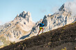 © Manu Prats/Stocksy - Energetic sportsman runnig uphill in mountain range