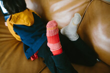 Childs Feet With Mismatched Socks