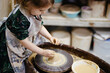 © Vradiy Art/Stocksy - Happy child in pottery workshop
