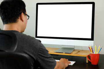 Poster - young man working Businessman using a desktop computer of the blank screen