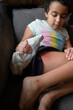 © Jennifer Bogle/Stocksy - Girl examines scraped and bruised leg