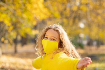 Poster - Happy child wearing protective mask in autumn park